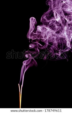 Incense Stick with Smoke on Black Background
