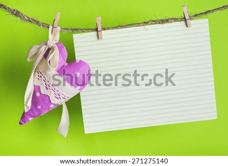 message card with handmade heart of the cloth with polka dots on a rope with clothespins, greeting and love concept,  happy birthday, Congratulations on March 8