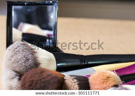 Makeup tools and a mirror