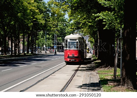 Tram car running along the line in city
