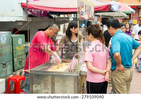 Sankeng Old Street, Longtan District, Taoyuan City, Taiwan - May 17, 2015: A maltose vendor at Sankeng Old Street, Sankeng Old Street is a traditional Hakka community in Taiwan.