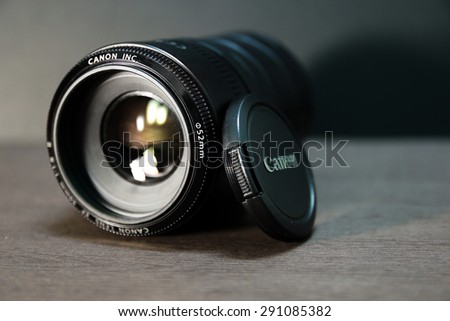 Taoyuan City,Taiwan - June 27, 2015: Very popular Canon EF 50mm f/1.8 II lens with extension tube on black background