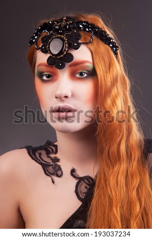 beautiful and graceful woman with painted underwear on her face, body painting