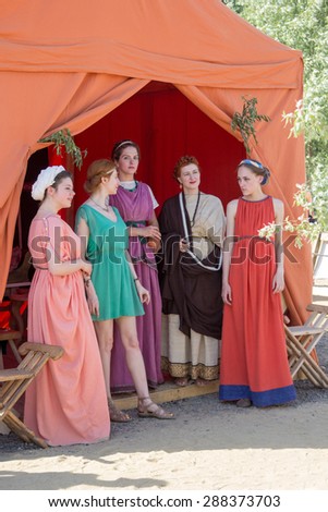 MOSCOW, RUSSIA - JUNE 7, 2015: Five women in ancient Roman dresses at Times and Epochs: Rome historical festival