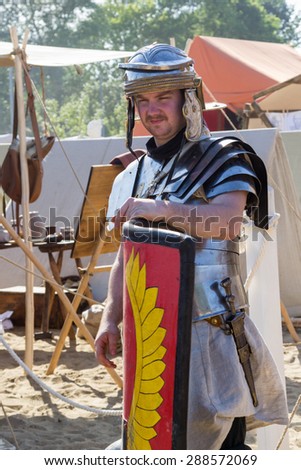 MOSCOW, RUSSIA - JUNE 7, 2015: ancient Roman soldier with shield and weapon at Times and Epochs: Rome historical festival
