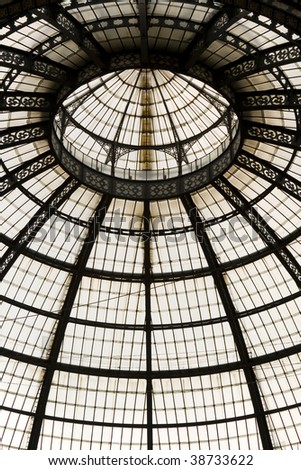 Famous shopping center Vittorio Emanuele glass dome and ornaments in Milan, Italy.