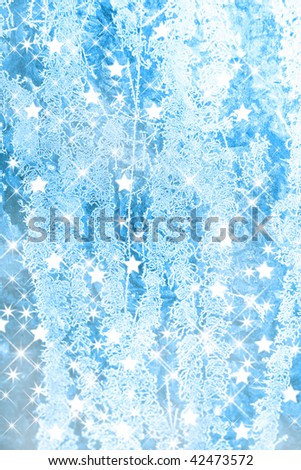 Christmas background with blue ice flowers and stars.