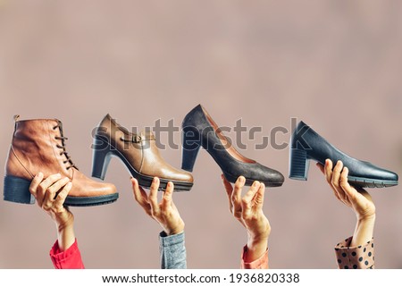 Hands holding different women shoes and boots. Concept of selection, purchase and repair of shoes ストックフォト © 