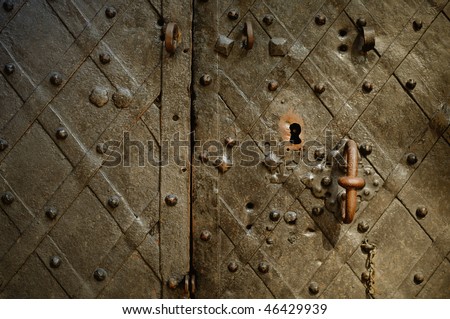 fragment of the old wrought bronze doors of the palace with a handle and lock