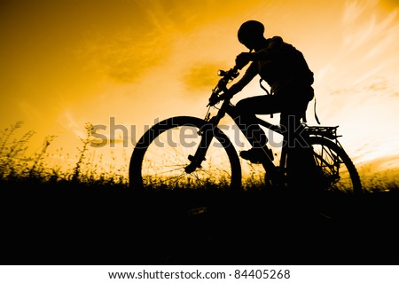 woman mountain bike sunset silhouette