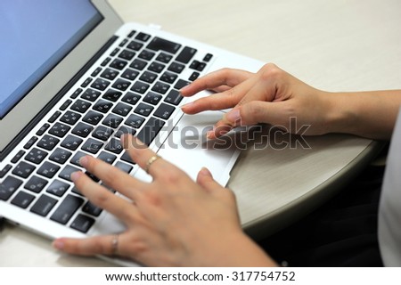 I operate a PC./It is a working Japanese woman.A hand is gentle and is beautiful.