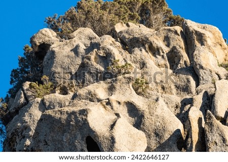 Similar – Image, Stock Photo Rocky formations near still lake