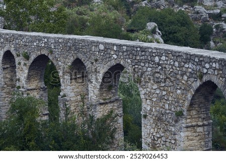 Similar – Image, Stock Photo Old stone viaduct in mountains