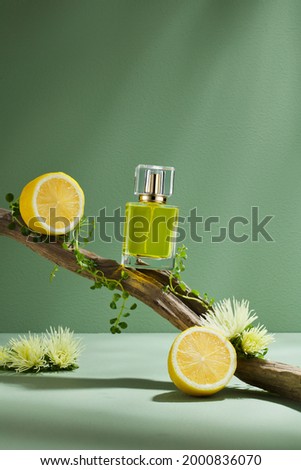 Minimal abstract cosmetic green background for product presentation. tone, wood shape with lemon yellow ingredients shades over concept background. Can use as perfume and cosmetics mock up.