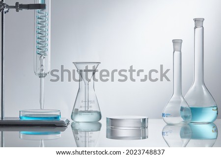 Empty podium glass with glass geometric platform. science laboratory test tubes, chemical laboratory equipment. Research and develop cosmetic in lab. 