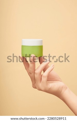 Similar – Image, Stock Photo Hand holding a glass of kefir