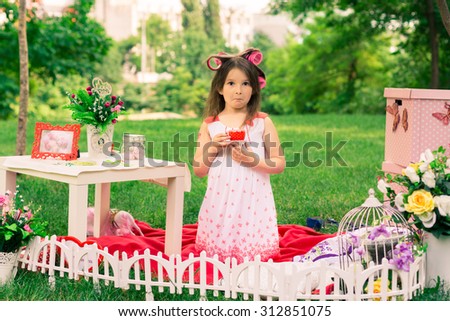 Girl drinking tea in nature