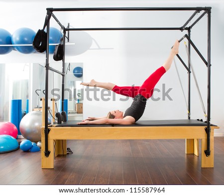 Aerobics pilates instructor woman in cadillac fitness exercise