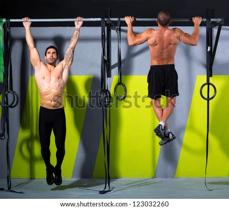 toes to bar men pull-ups 2 bars workout exercise at gym