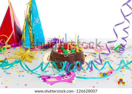Children birthday party with chocolate cake confetti garland and serpentine