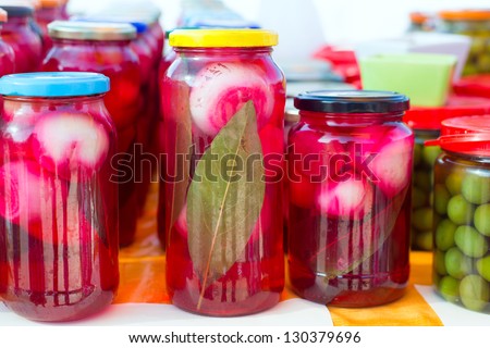 mediterranean pickled onions in red vinegar glass pots traditional tinned food