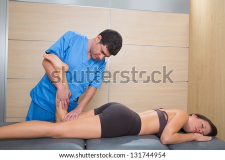 muscle power therapy on woman leg knee by therapist