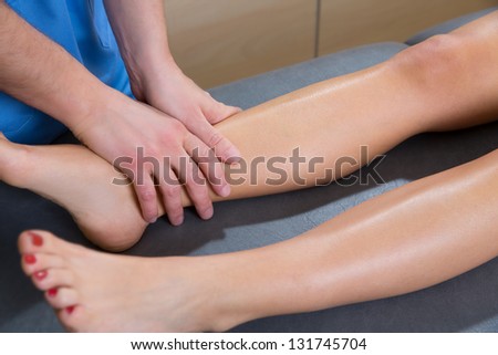 lymphatic drainage massage therapist hands on woman leg ankle