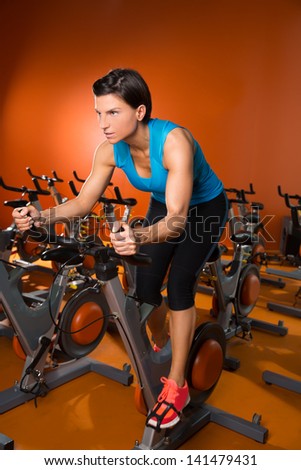 Aerobics woman workout on orange bike