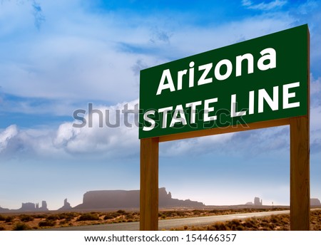 Road sign between Utah and Arizona State Line in Monument Valley