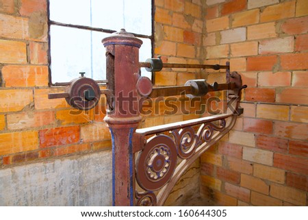 steelyard roman balance romaine grunge antique in a brickwall