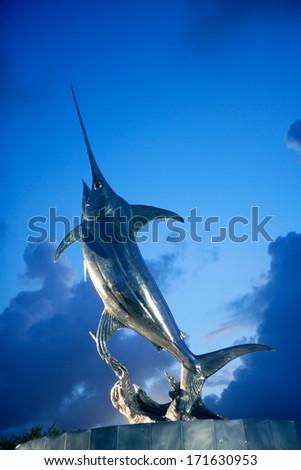 DANIA BEACH, FLORIDA - JAN 20, 2010: IGFA Sword Dance sculpture fountain of silver swordfish in Dania Beach, Florida, January 20, 2010. Sculptor is Kent Ullberg