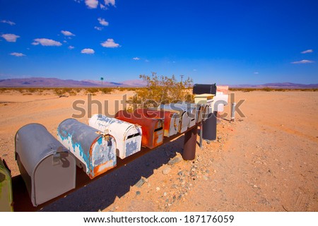Grunge mail boxes in a row at California Mohave desert USA