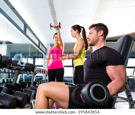 Dumbbell man at gym workout fitness weightlifting and dumbbell women personal trainer