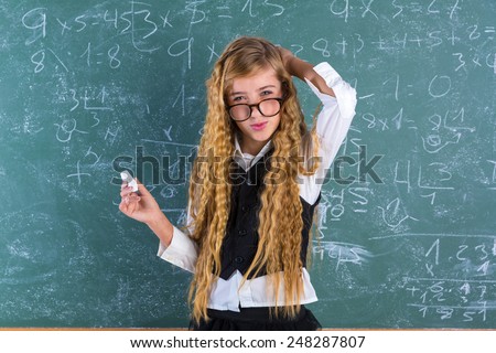 Clever nerd pupil blond girl in green board student difficult expression schoolgirl