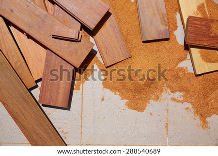 Carpenter sawdust and decking pieces after ipe wood deck work