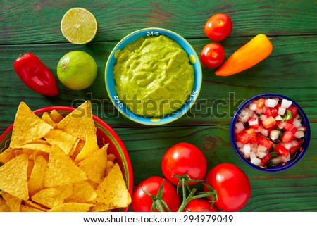 Mexican food nachos guacamole pico de gallo and chili peppers sauces