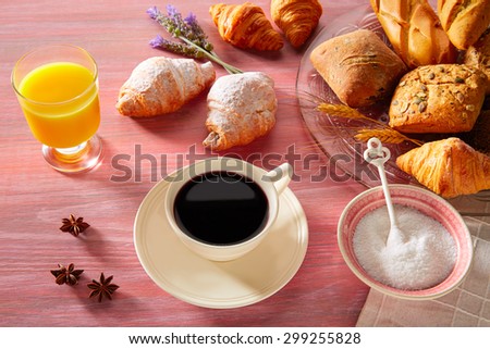 Coffe breakfast with orange juice croissant bread and yogurt