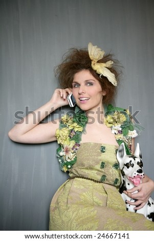 Modern fashion original woman talking phone with dalmatian dog