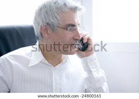 businessman portrait calling phone, senior gray hair