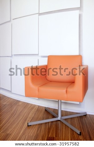 Modern office lobby interior design, orange leather chair , wooden floor