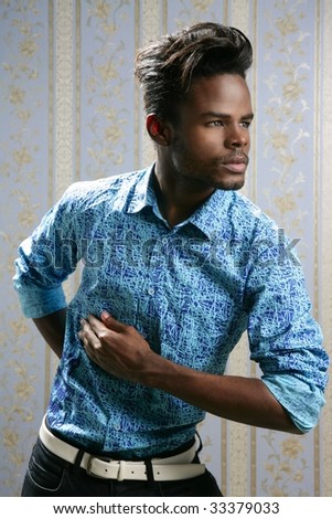 African american fashion model portrait on blue wallpaper background