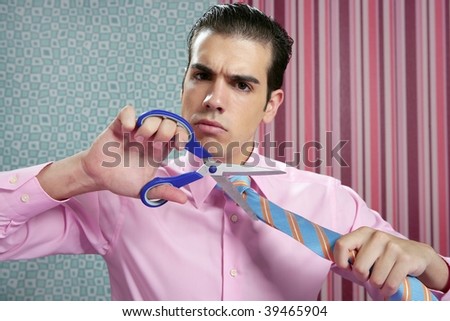 Businessman stressed with scissors trying to cut his tie