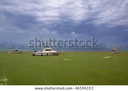 Africa Saly Senegal green ocean cloudy storm sky and boats