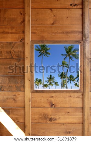 Tropical palm trees view from wooden window house room [Photo Illustration]