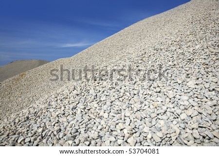 gravel gray mound quarry stock blue sky rolling stones