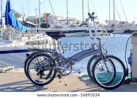 two bicycles marine folding bike marina port Formentera Balearic islands