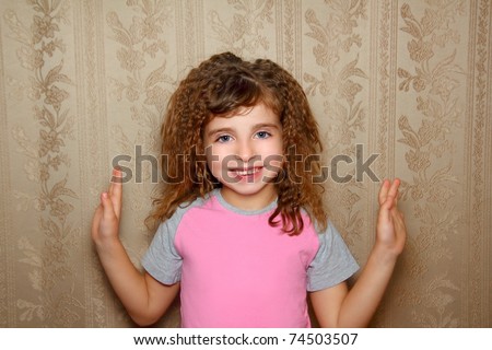 little girl happy funny expression on vintage retro wallpaper