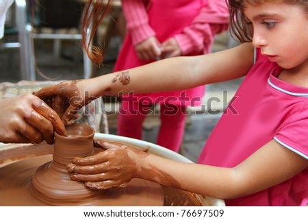 clay potter hands wheel pottery work workshop teacher and girl pupil