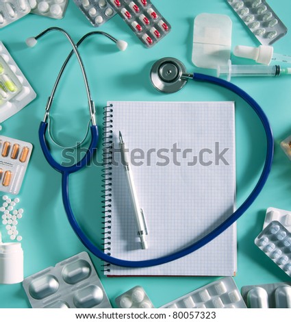 doctor desk workplace stethoscope spiral notebook blank copyspace