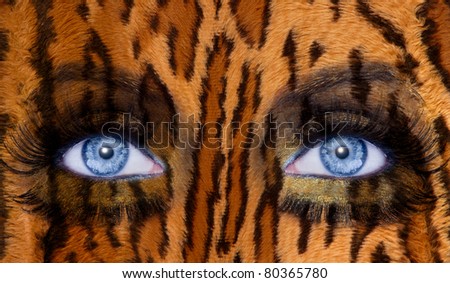 abstract blue woman eyes makeup with a leopard jaguar skin texture [Photo Illustration]